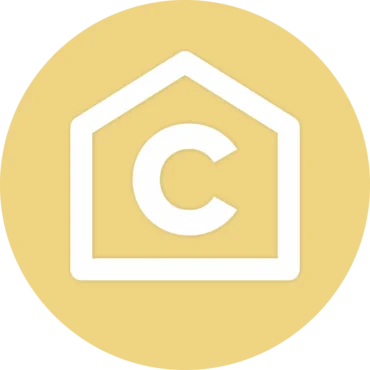 Círculo amarelo com um ícone de casa branco e uma letra C no meio